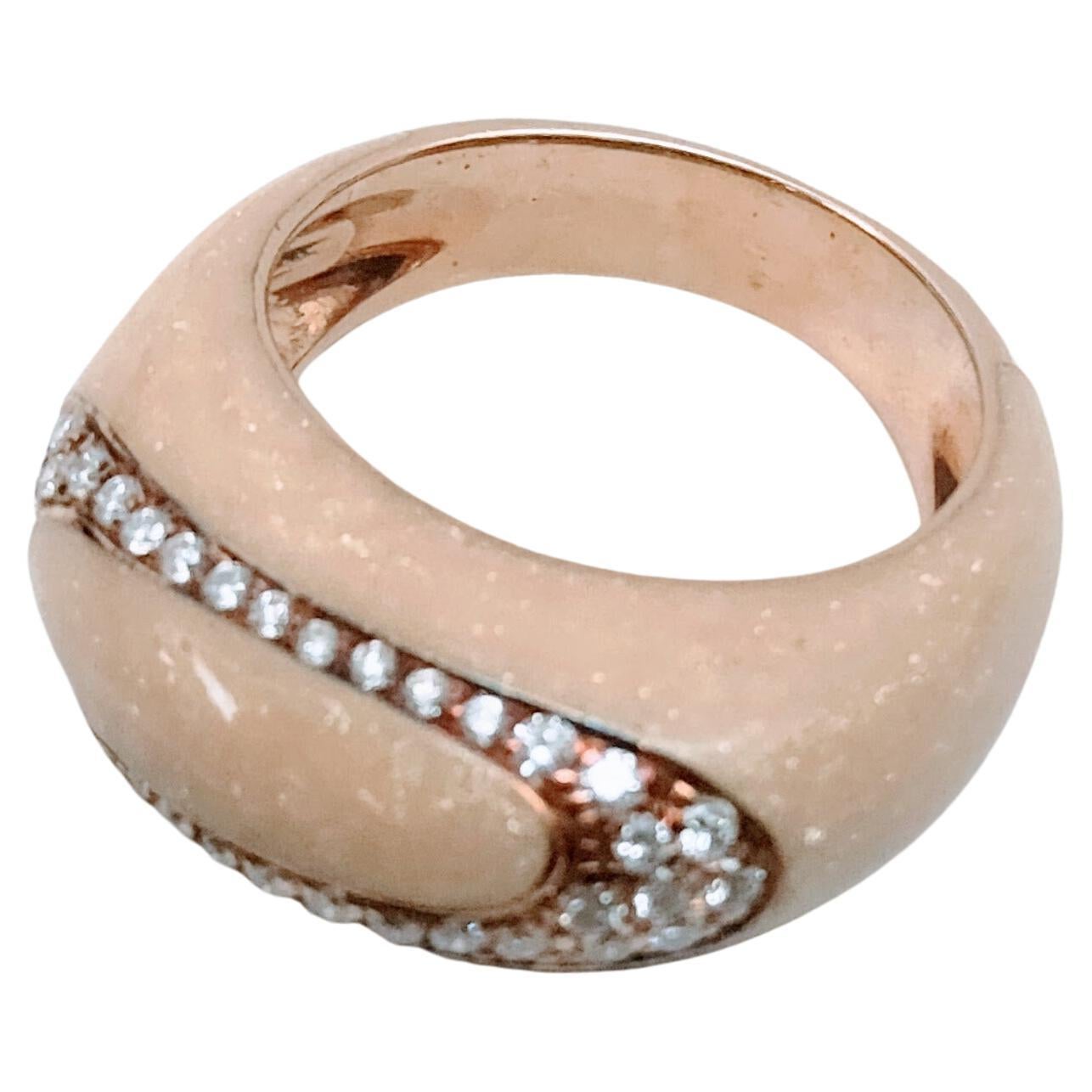 Exquisite white Enameled Ring Cabochon Format curvilinear motifs by the designer Alessandro Fanfani make in Yellow Gold 18 Karats weight 11.69 grams with 29 diamonds brilliant cut total weight 0.50 carats. Setting in grains. 
Ring Siza: 16.5