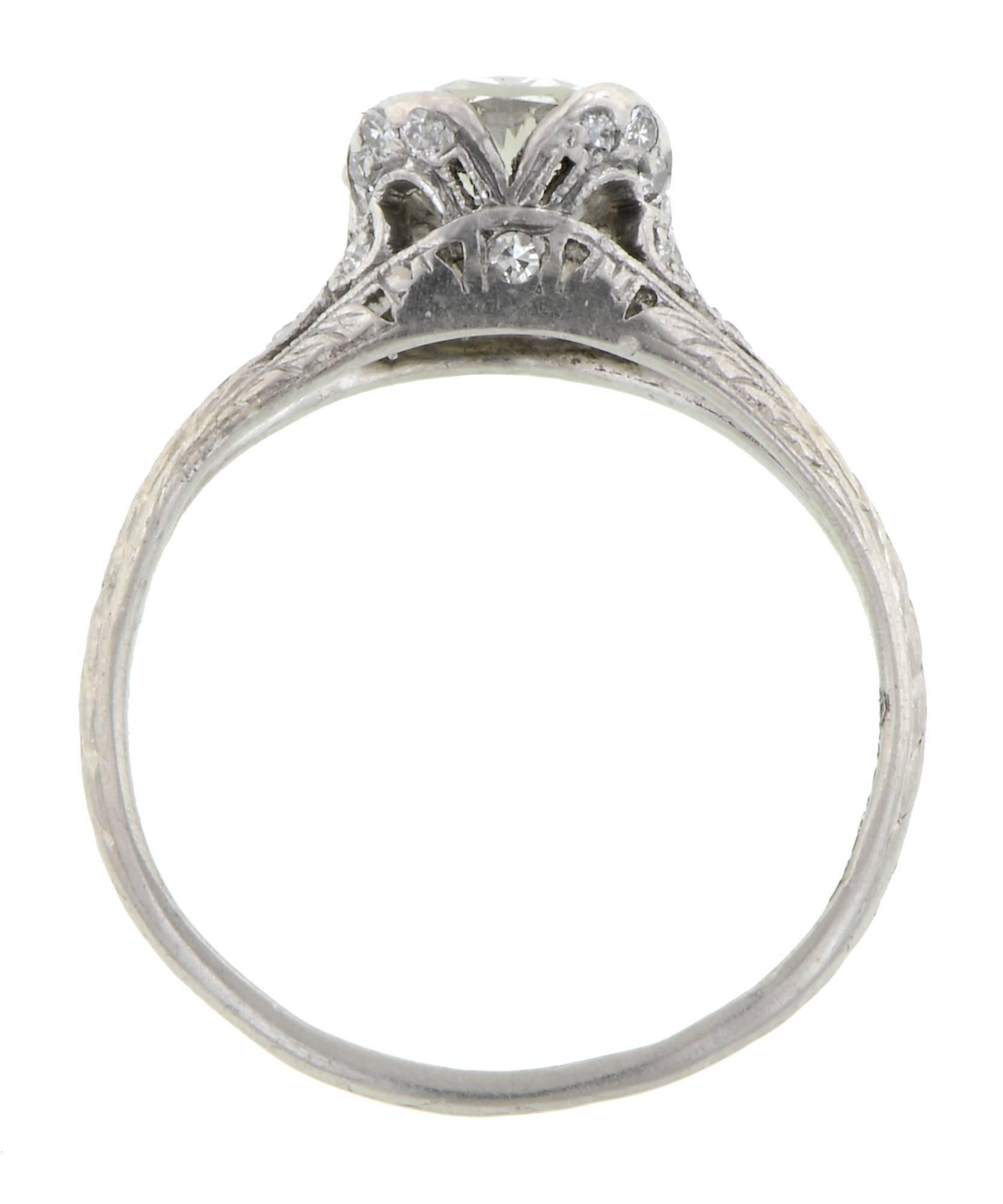 Edwardian Diamond Engagement Ring, TRB 1.01ct centering a Transitional Round Brilliant cut (Circular Brilliant) weighing 1.01ct. (G color, VVS2 color), in a four prong mounting set with 20 Single cut diamonds weighing app. 0.20 in a stylized scroll