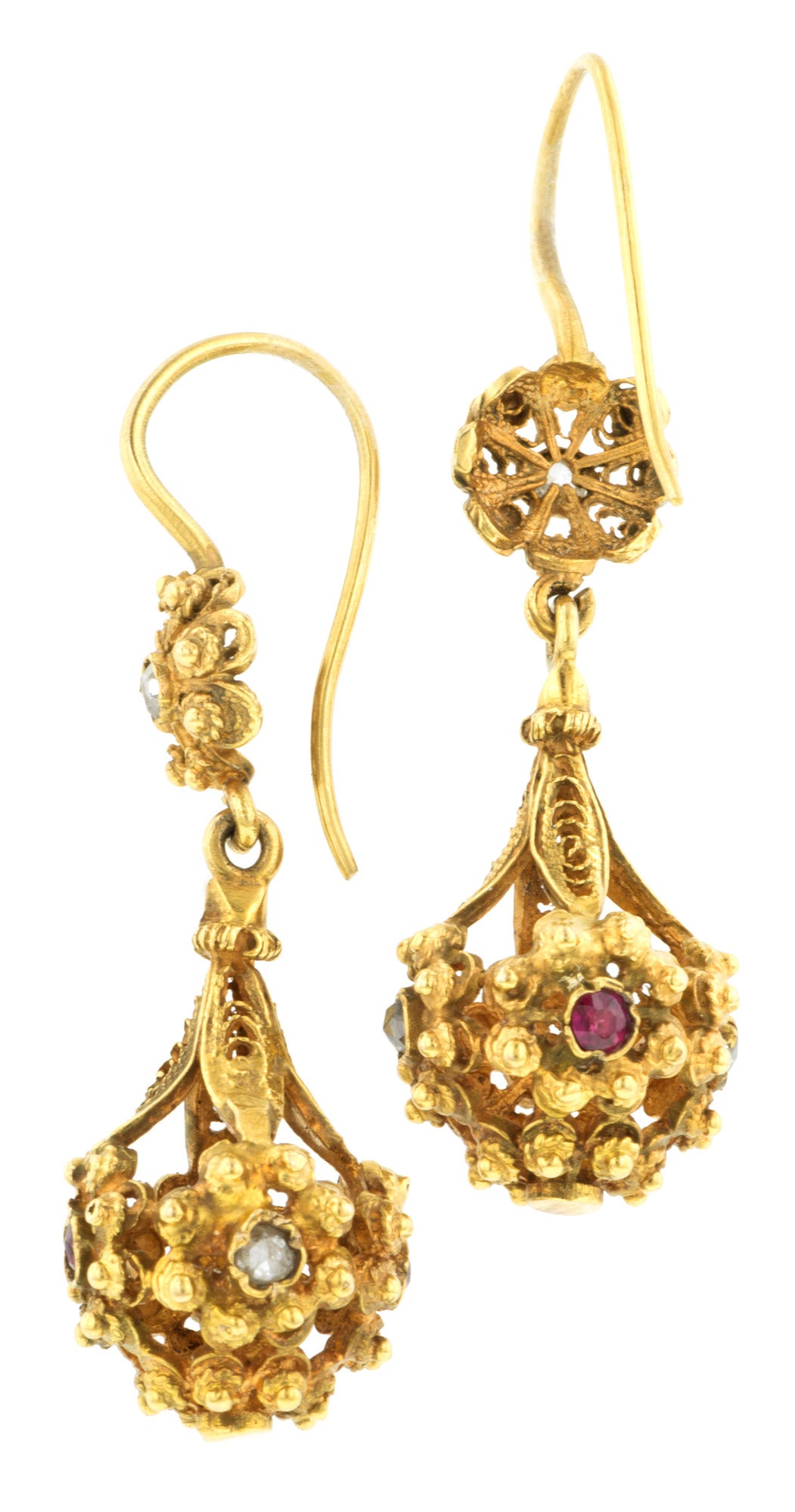 Victorian Ruby & Diamond Drop Earrings set with rubies and Rose cut diamonds, both measuring app. 2.0mm, in an open work, flower cluster drop, fashioned in 18k gold. Circa 1890. Length 1 5/8 inches.