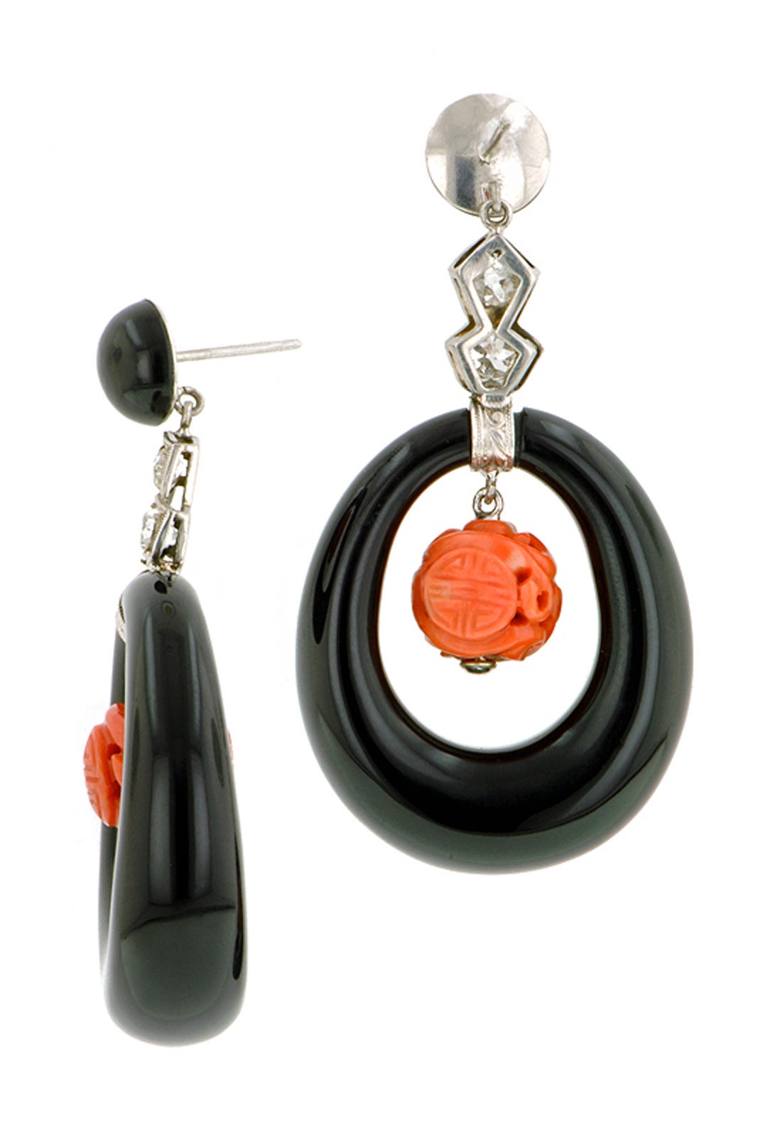 Vintage onyx diamond & coral earrings with onyx tops suspending Old Mine cut diamonds weighing app. .64ctw. and carved coral drops measuring app. 10mm,within onyx hoops measuring app. 32mm x 28mm, fashioned in platinum with 14kw gold backs.