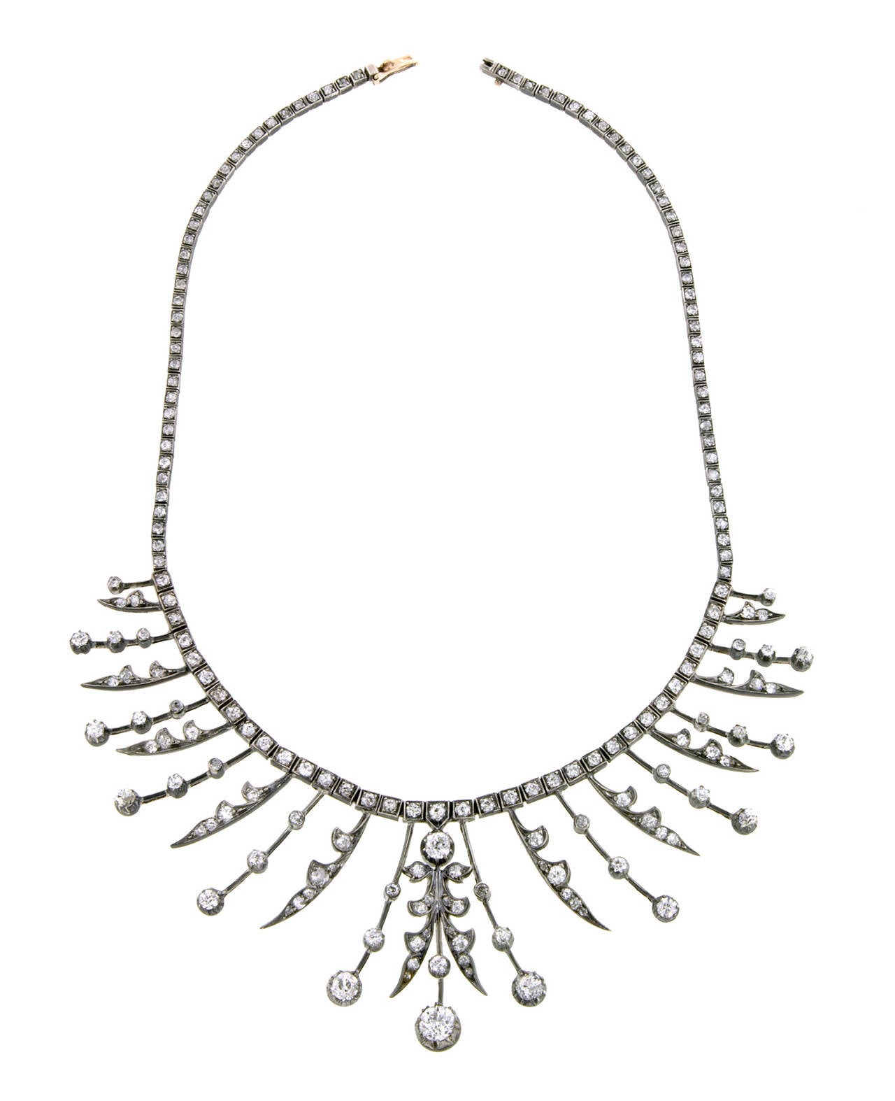 Victorian diamond fringe necklace featuring Old European cut diamonds weighing app. 12.87ctw., in a graduated fringe style, fashioned in silver topped 14k gold.  Circa 1890. Length 14 1/4 inches