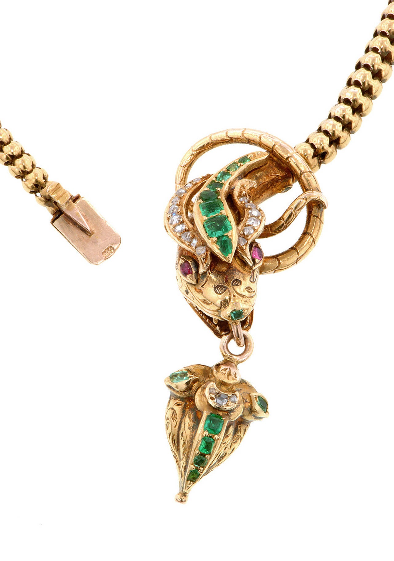 Victorian emerald & diamond snake necklace with locket-back drop measuring app. 1 3/4 x 3/4 inch wide, set with emerald, round and pear cut emeralds measuring app 1.0 - 2.5mm, Rose cut diamonds (1.0 - 1.5mm) and ruby eyes (1.5mm), fashioned in 14k.