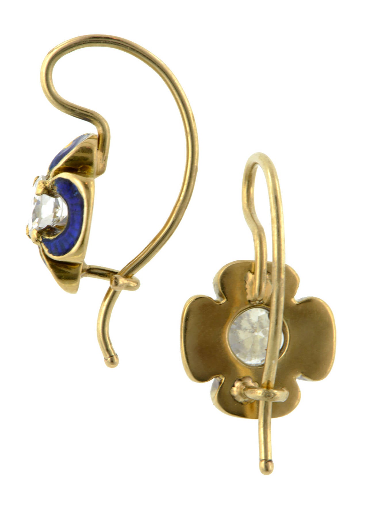 Antique diamond enamel flower earrings centering Round Brilliant cut diamonds weighing app. 0.40ctw., in four petal, blue enamel flowers, fashioned in 18k gold. Circa 1880, with newer diamonds and replaced ear wires.
