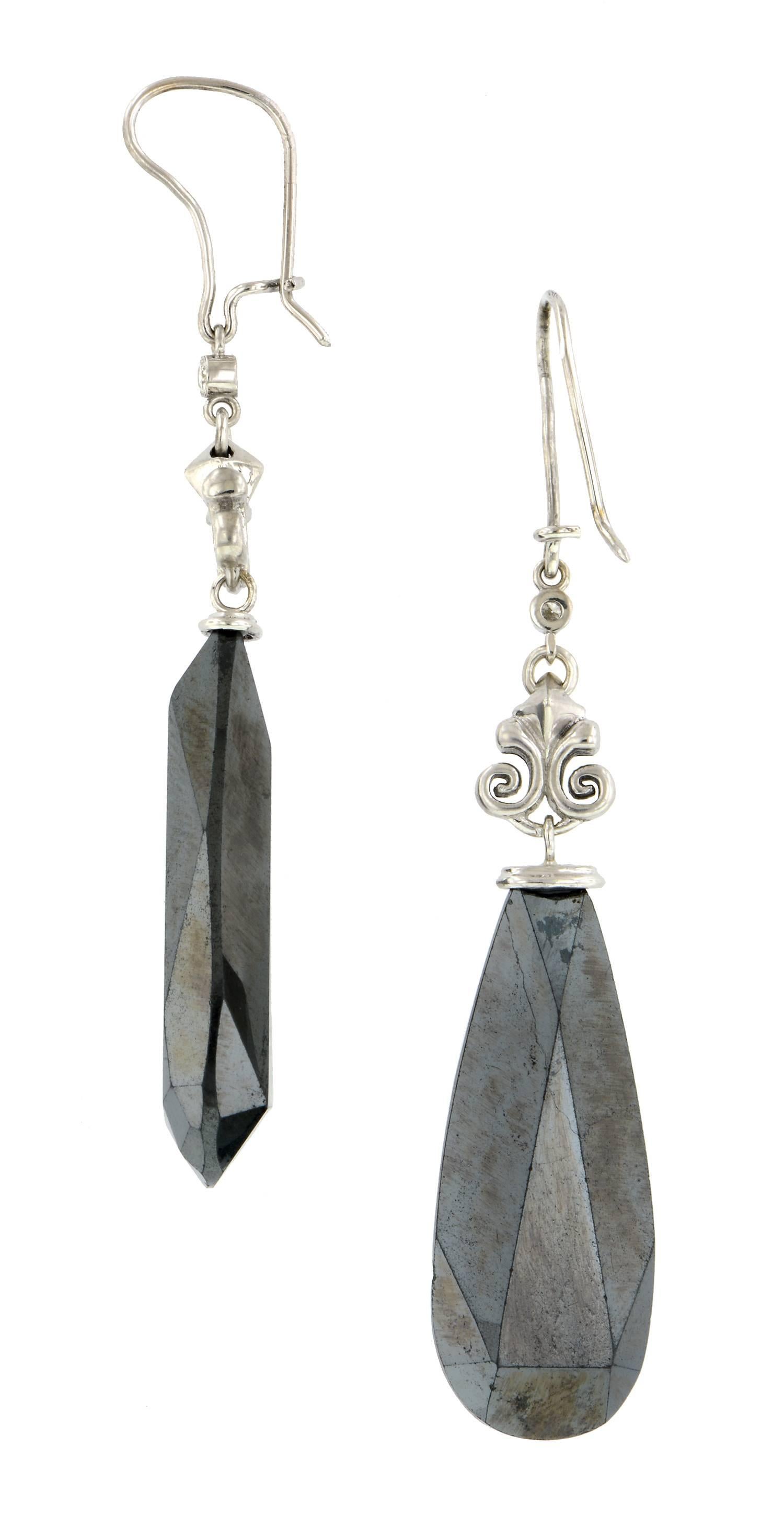 Hematite & Diamond Drop Earrings by Doyle & Doyle measuring app. 2 1/2 inches in length, set with two Round Brilliant cut diamonds weighing app. 0.07ctw, fashioned in 18k white gold. Contemporary.