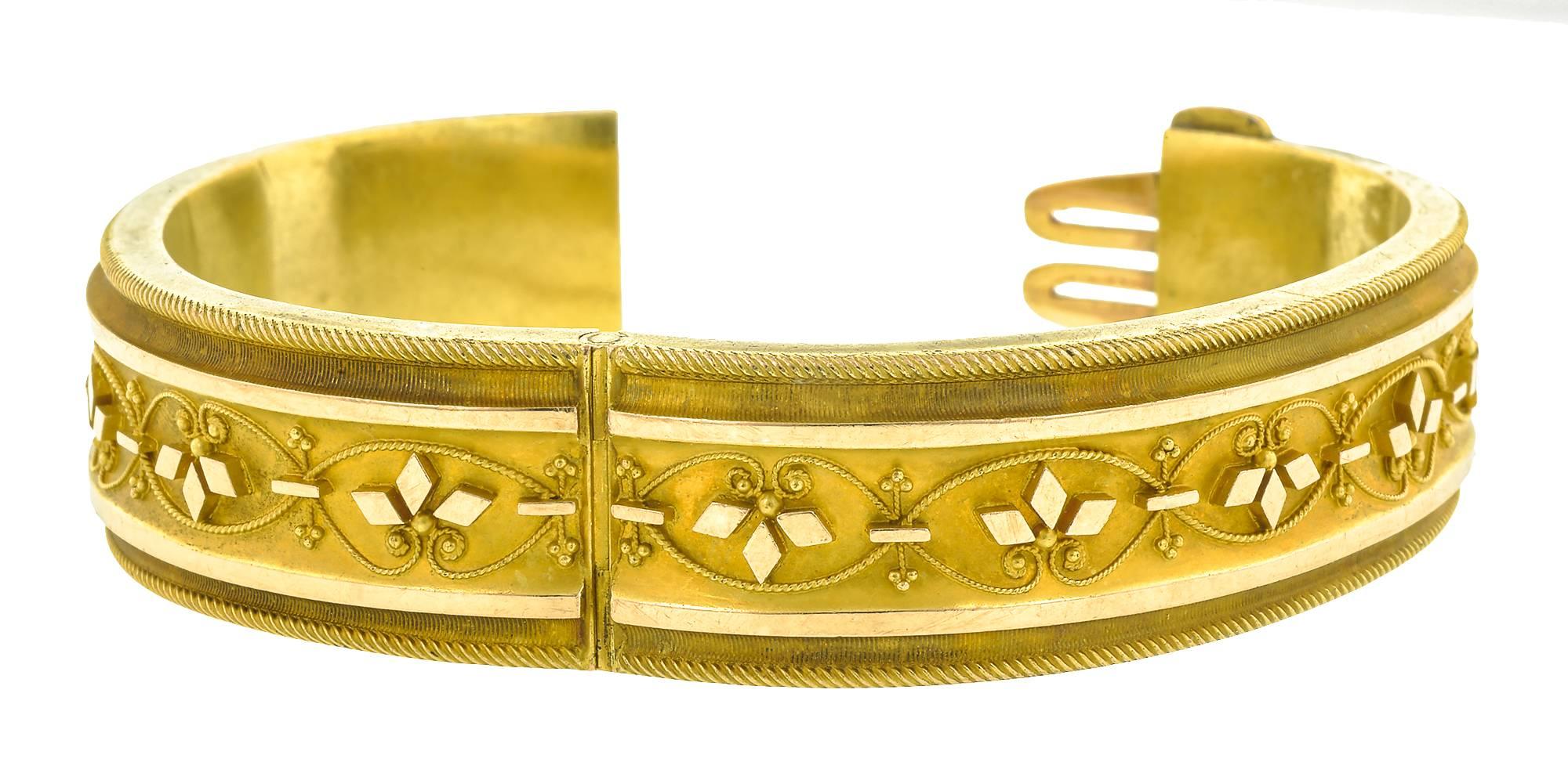 Victorian Etruscan Revival bangle bracelet measuring 5/8 inch, fashioned in 14k.
