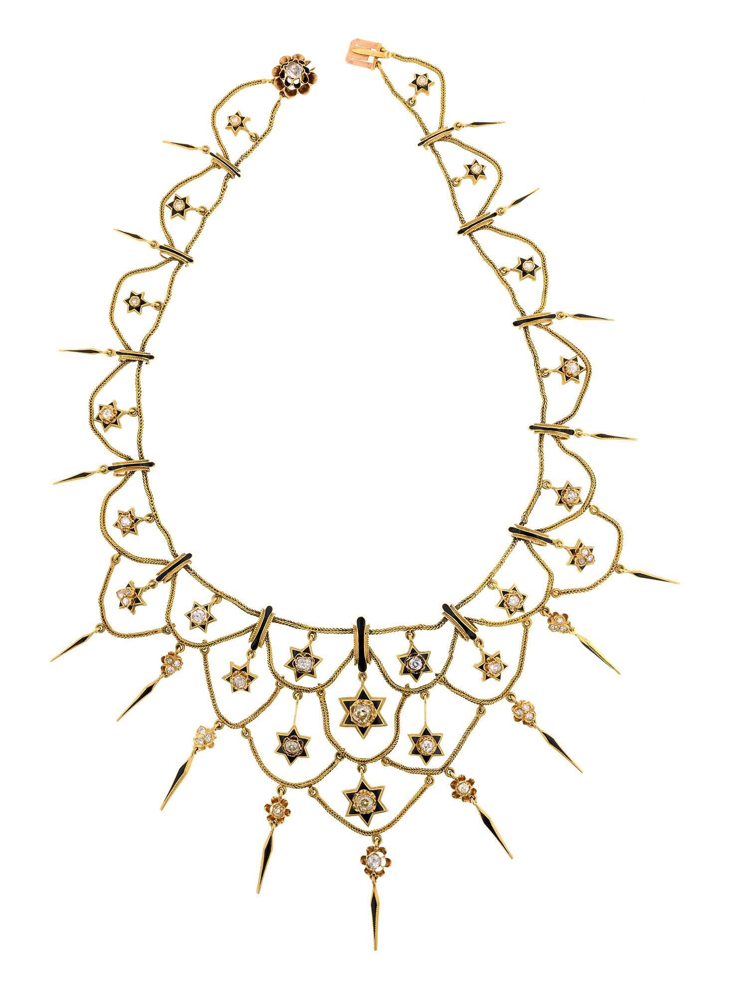 Antique diamond festoon  necklace set with 29 diamonds of various cuts all weighing app 4.04ctw, embellished with black enamel in a festoon style necklace with star and fringe details, fashioned in 18k. French. Circa 1870. Length 16 inches.