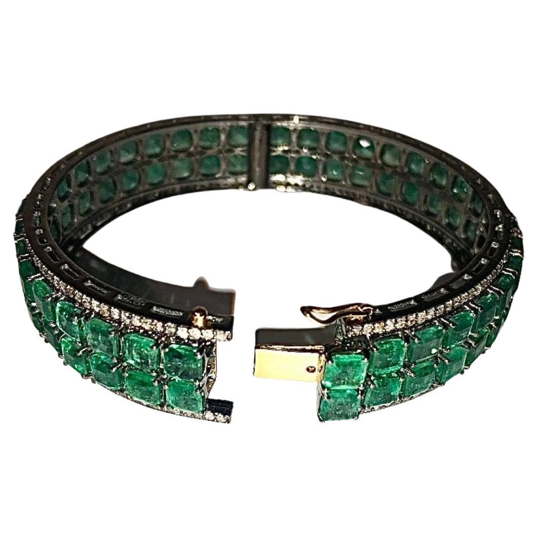 Description
Just imagine how you would feel and the heads that would turn as you don this exceptionally gorgeous and vibrant double row Colombian Emerald bracelet surrounded with pave diamonds. Every aspect of this bracelet creates its own charm and