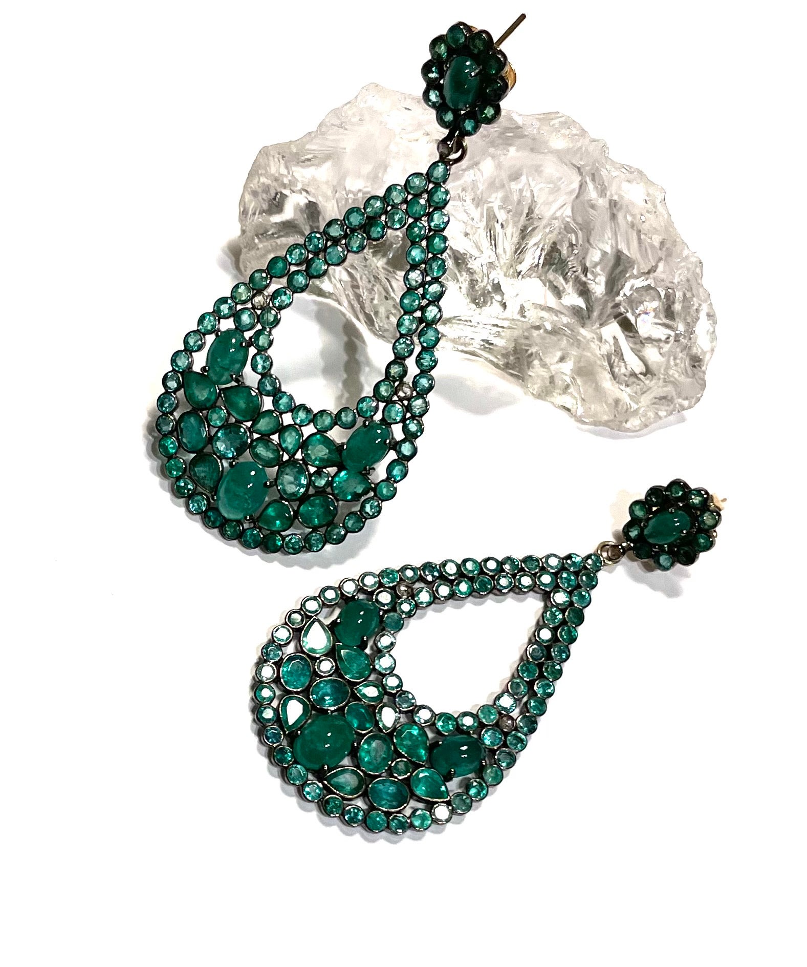 Description
Vibrant 24 carat Columbian Emerald earrings in a feminine pear-shape design, featuring a beautiful mix of  faceted and cabochon shapes and sizes with delicate diamond accents.
Item # E2785

Materials and Weight
Emeralds 24 carats,