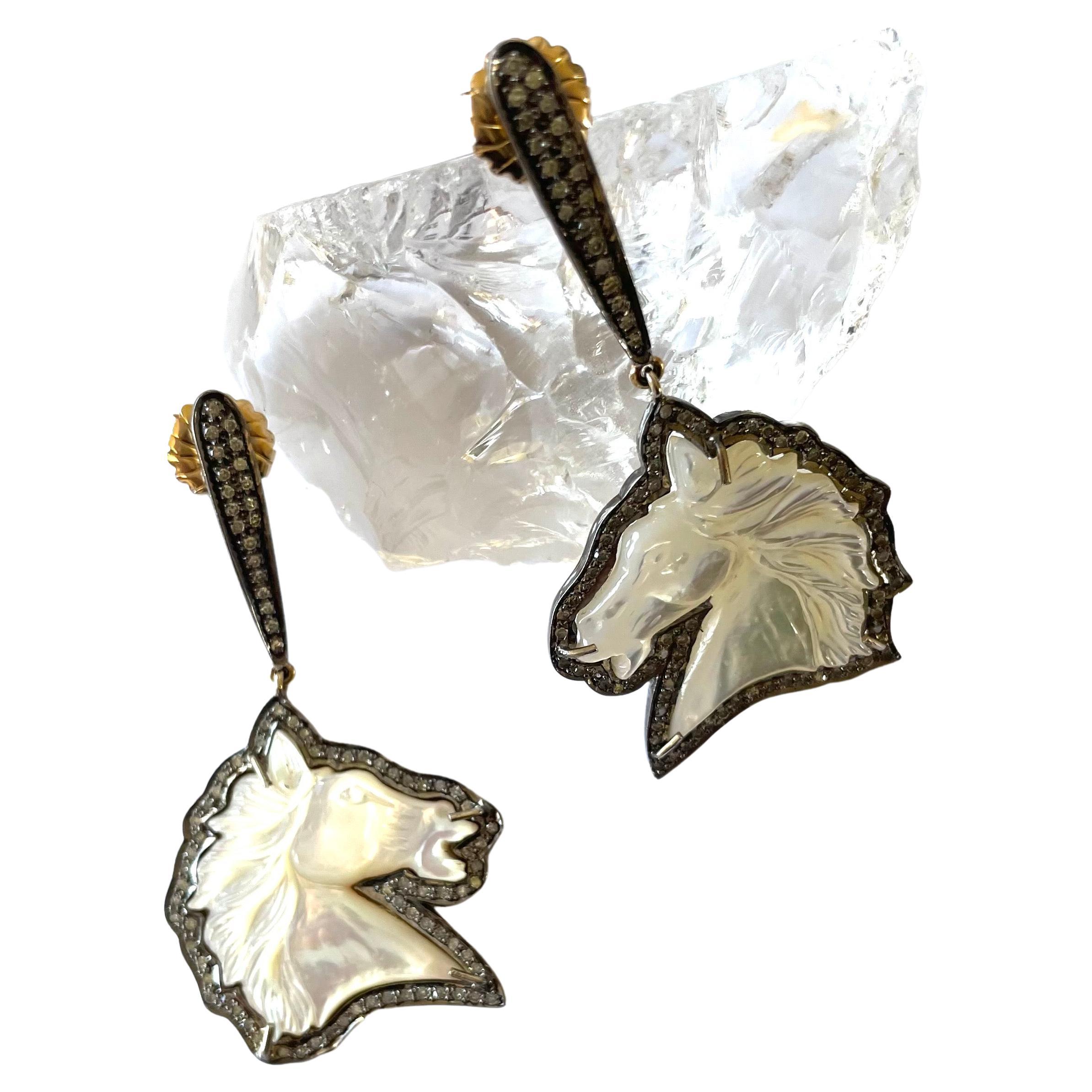 Description
Mother of pearl hand carved horses 28 carats, pave diamond earrings.
Item # E2638

Materials Weight
Mother of Pearl, horse shape, 28 carats.
Pave diamonds, 1.09 carats.
Posts and jumbo backs, 14k white gold.
Rhodium sterling