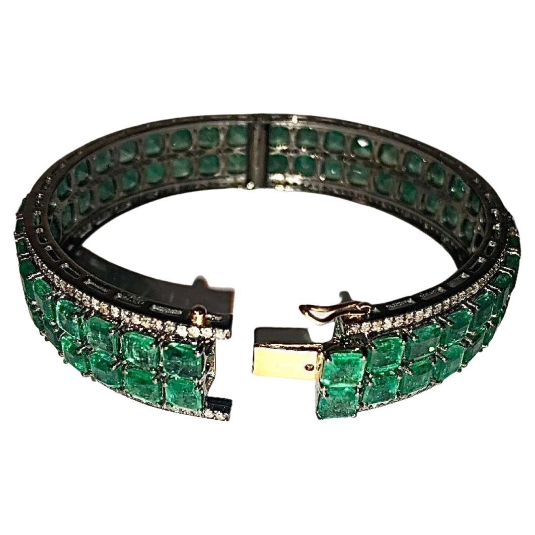 Description
Just imagine how you will feel and the heads that will turn as you don this exceptionally gorgeous and vibrant double row Colombian Emerald bracelet adorned with pave diamonds. Every aspect of this beauty creates its own charm, from the