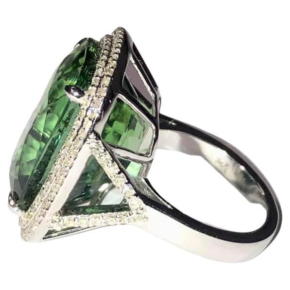 Description
Impressive, large, brilliant flawless rare-color Green Tourmaline with pave diamonds ring.
Item # R165

Materials and Weight
Green Tourmaline, 20.4 x 15.3 x 12mm, modified emerald cut, 31.6 carats.
Pave diamonds, 1.0 carats.
14k white