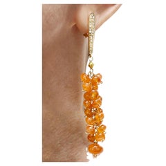 Boucles d'oreilles grappe en or et diamants avec spessartite orange 92 carats
