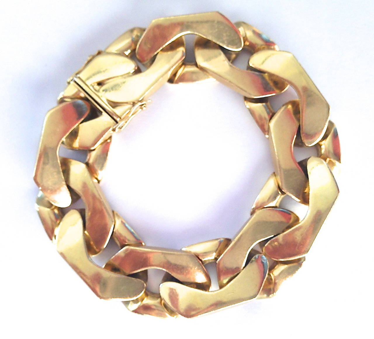 A handsome gold curb link bracelet by Cartier. A 7
