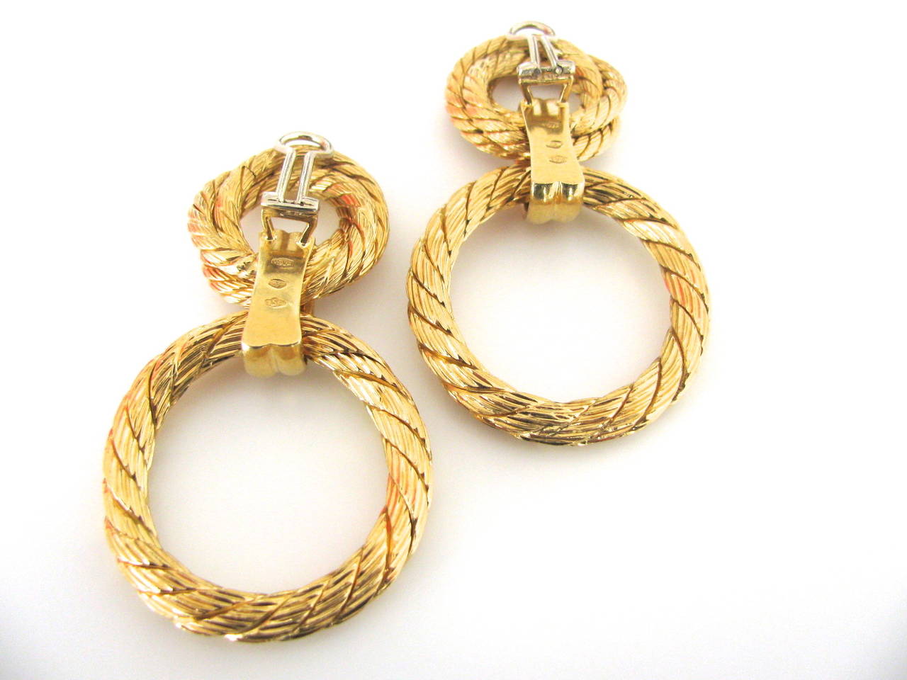 A Good-looking pair of gold doorknocker earrings. A pair of 2 1/2