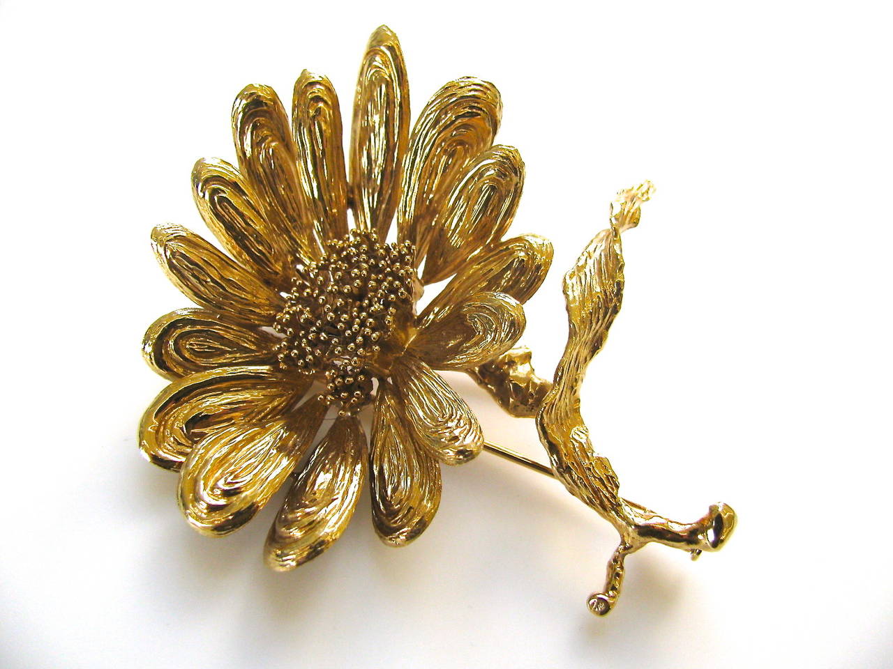 A charming gold flower pin by Chaumet. The 2 3/4