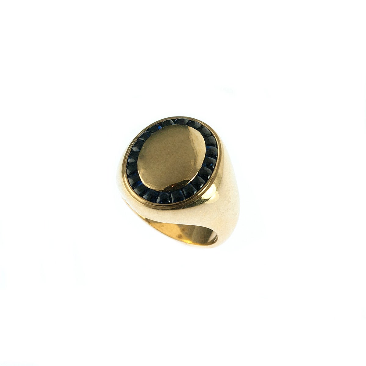 A handsome gold and sapphire men's ring by Deakin & Francis. The 1