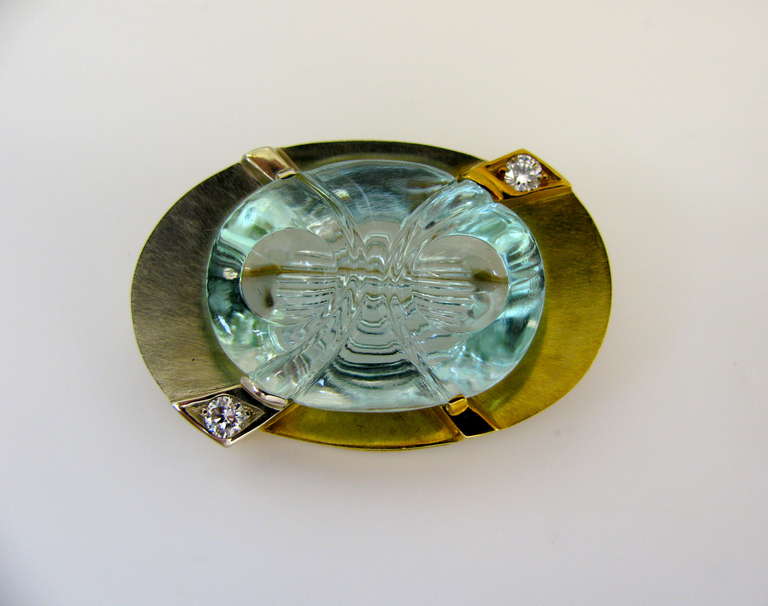 Michael Dyber, An artistic carved aquamarine. The 1 1/2