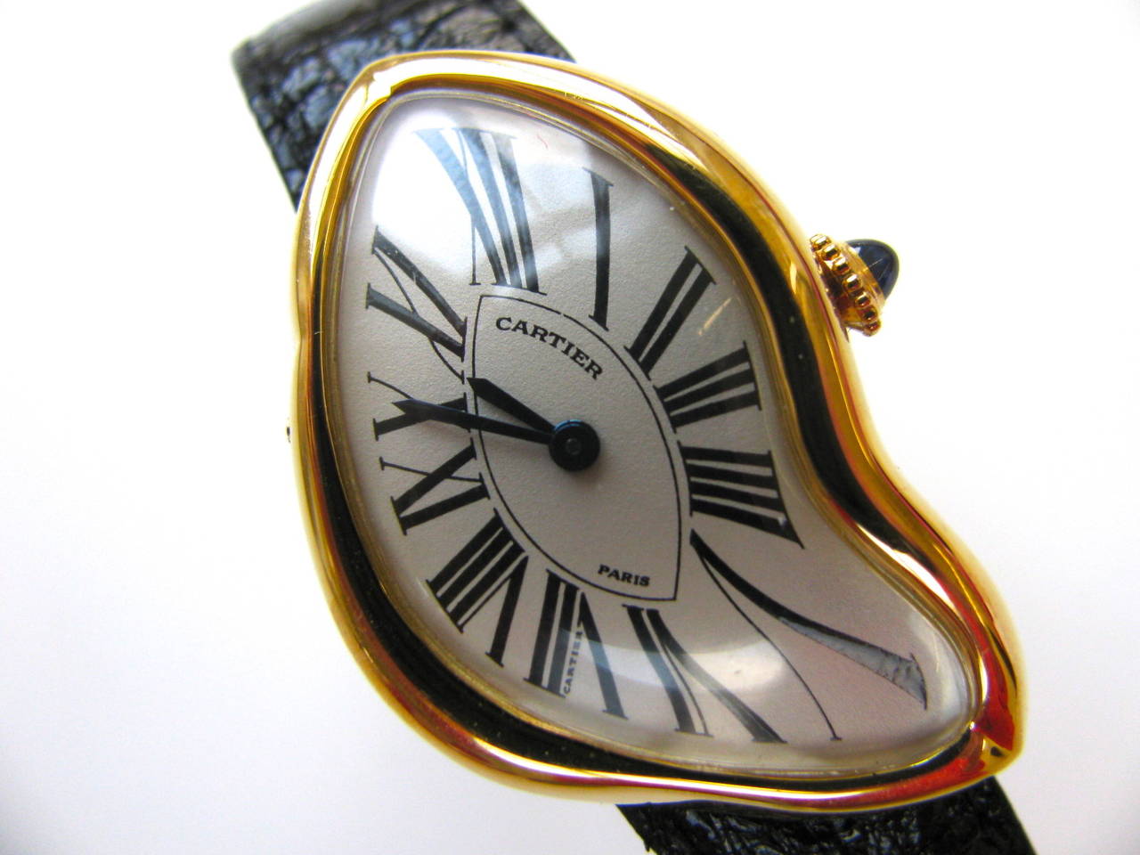 Cartier 1991 Crash Watch. A men's 18k Yellow gold asymmetric wristwatch No.  332/400. Produced originally by Cartier in 1967, this surrealist style watch was revived again , in a limited edition form, in 1991. This stunning example from 1991 is in