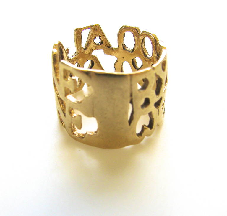 An affectionate ring by Eric De Kolb.  A 14K yellow gold 1/2