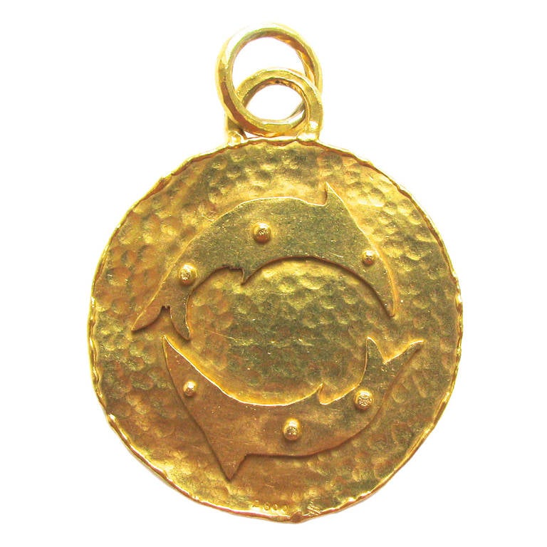 A Jean Mahie Gold Zodiac Pendant