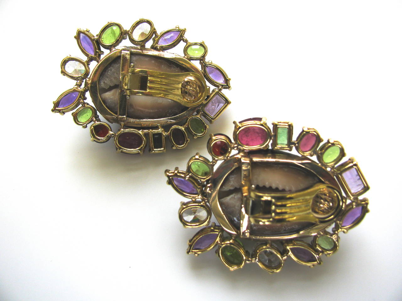 A bold pair of multicolored gemstone and shell earrings. The 18k yellow gold mounts each with a 1 1/4
