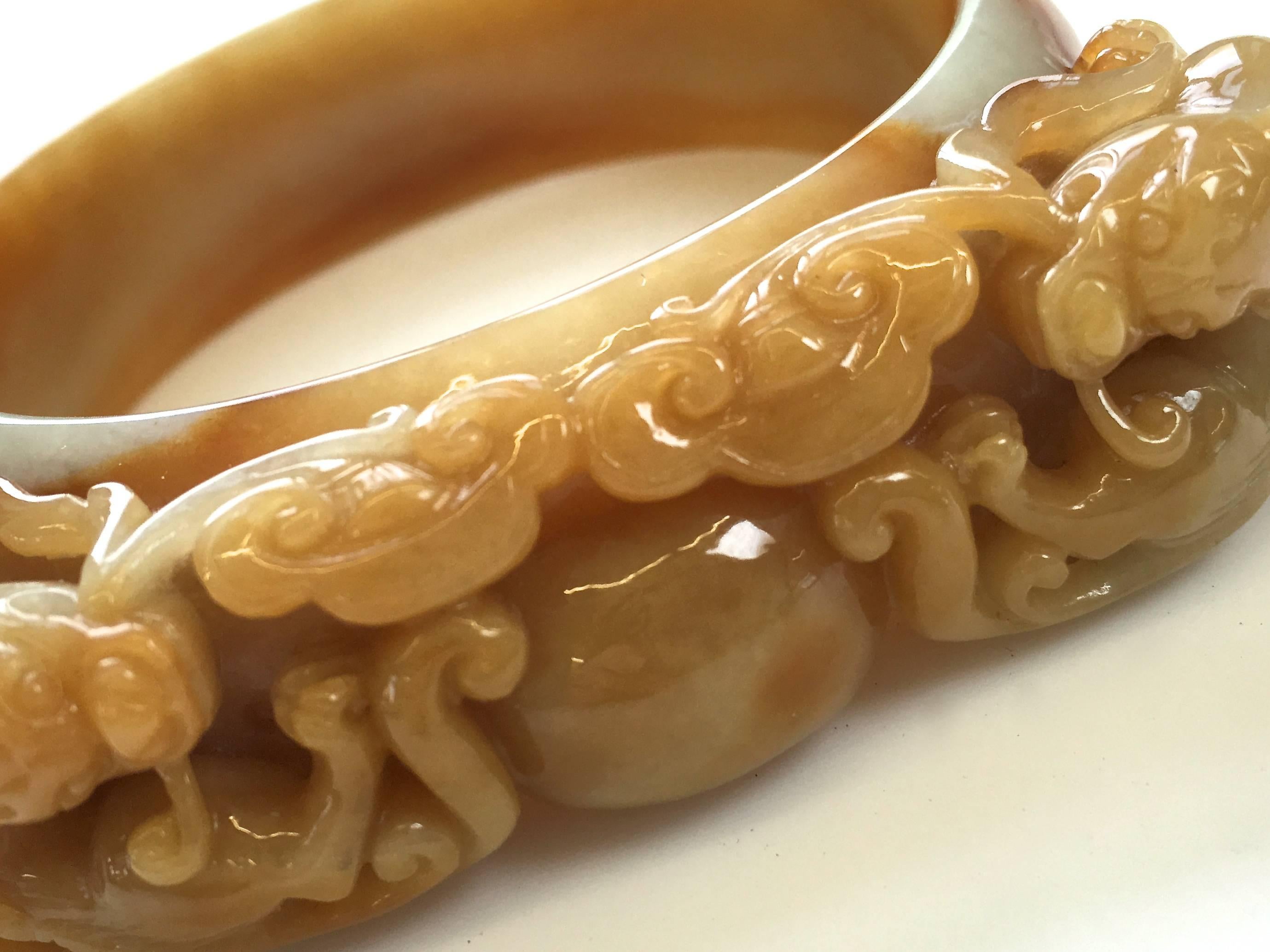 Butterscotch Jade, handsome carved bangle. The natural-color carved bangle with a 3
