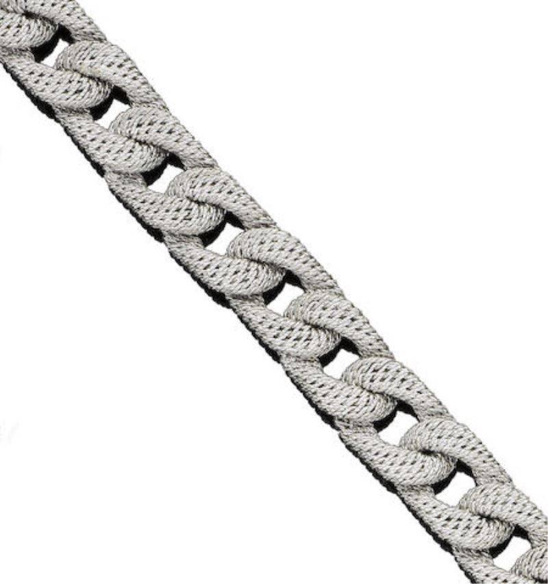 A handsome bracelet, by George L'Enfant. The 18k white gold 5/8