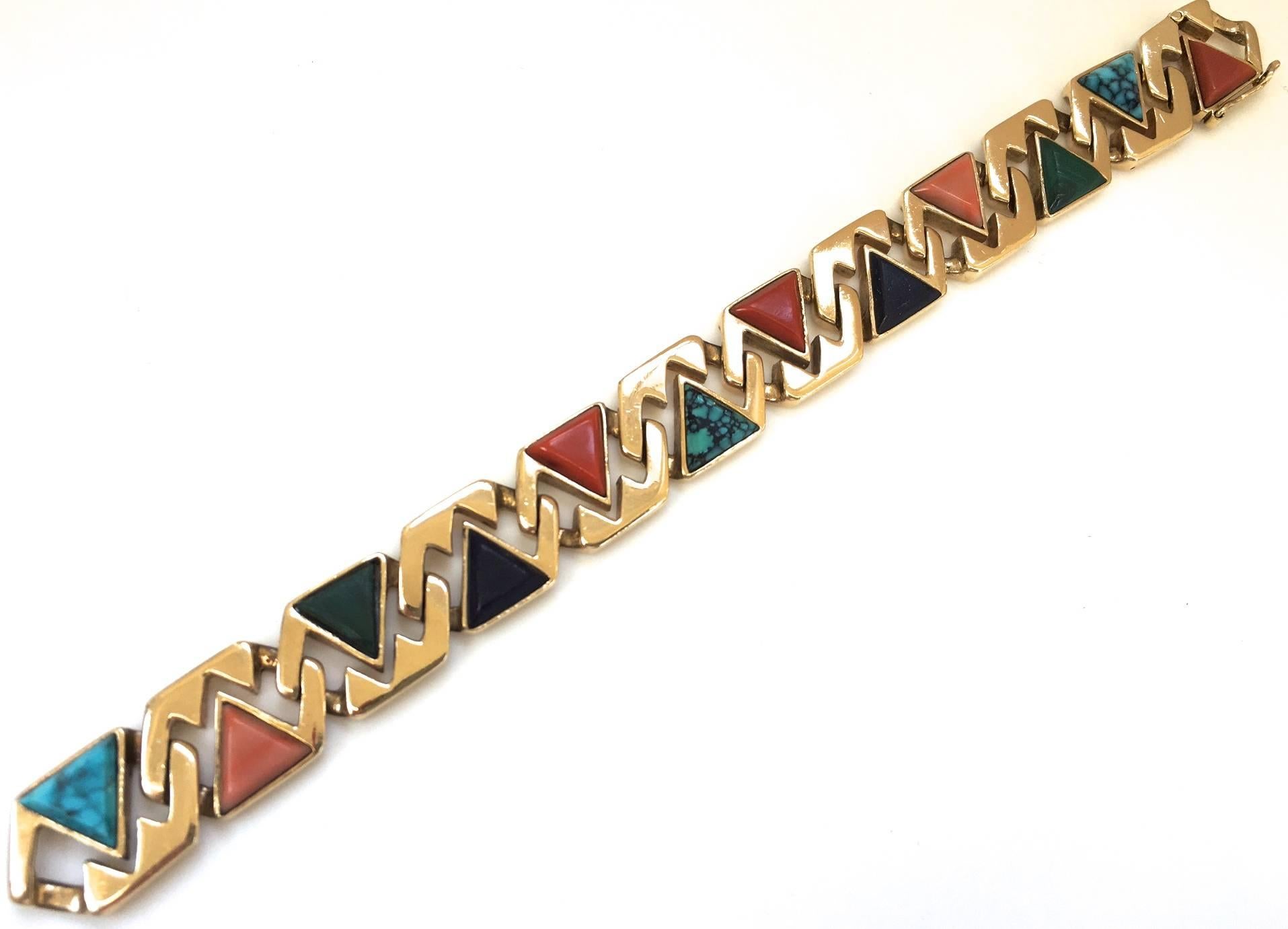 A chic reversible link gold and multigem bracelet. The 14k  1/2