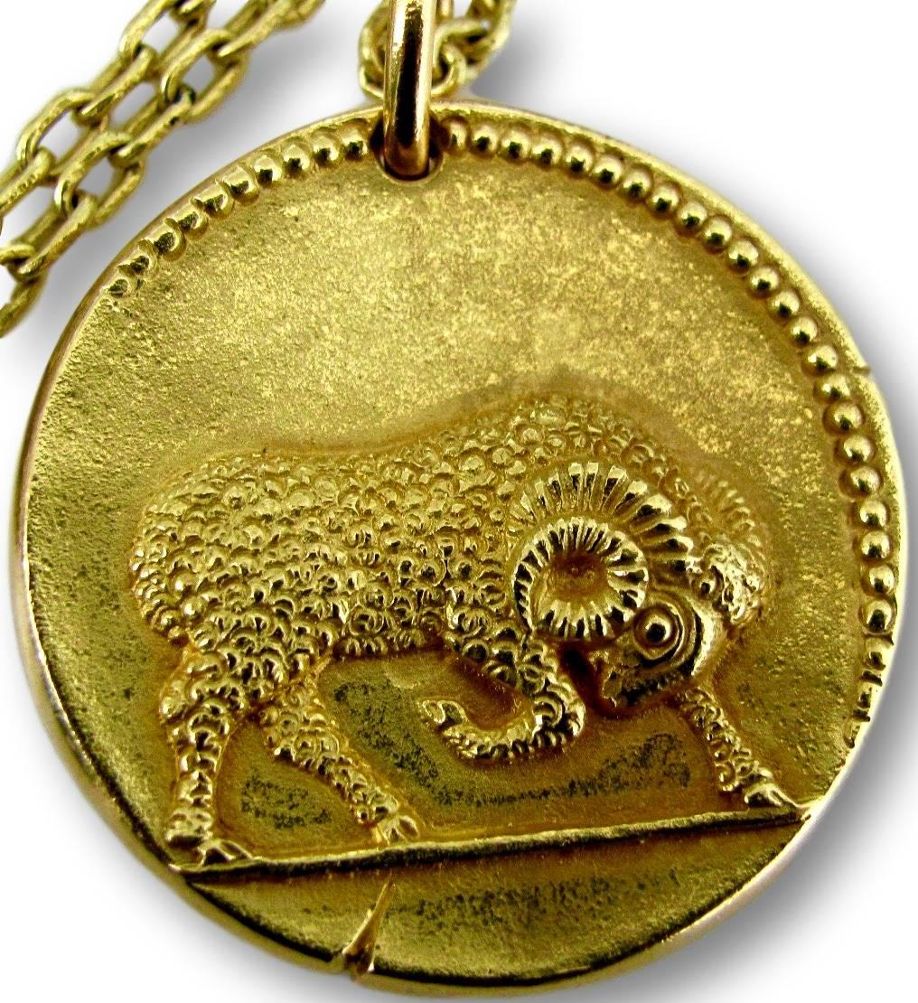 Van Cleef & Arpels handsome Zodiac pendant. The 18k  1 1/2