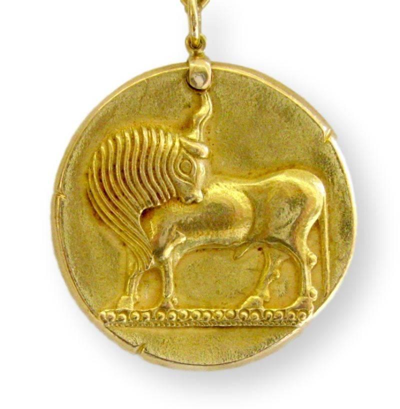 A large V.C.A. Taurus Pendant and Chain. The 1 5/8