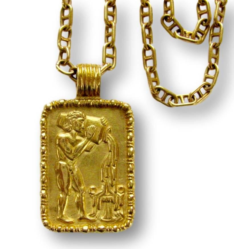 18k Yellow gold zodiac pendant by Fred of Paris. The rectangular 1 5/8