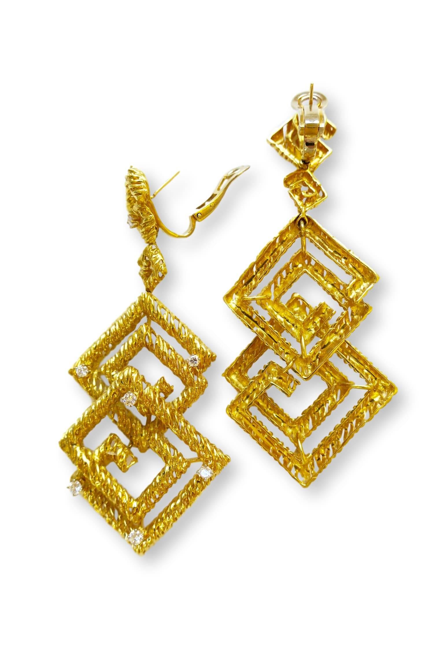 Geometric 18k gold dangle earrings circa 1970. The 3 1/2" x 1 1/2" long earrings each with seven briliiant-cut round white diamonds . Vs1- g color, hinged at the top for movement and hanging from a french clip for security. Love these