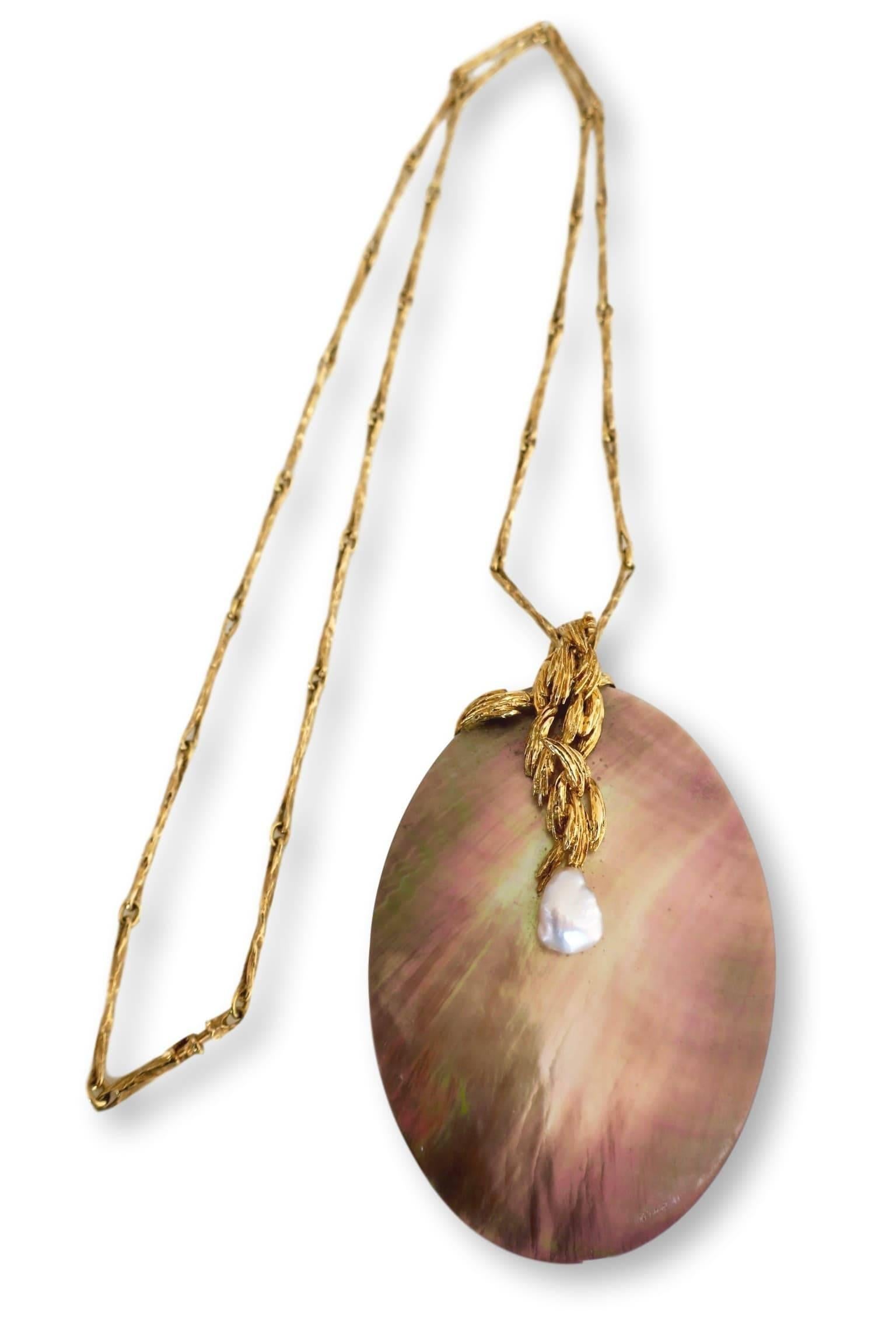 18k gold pendant necklace by Swiss designer Gilbert Albert. The 29