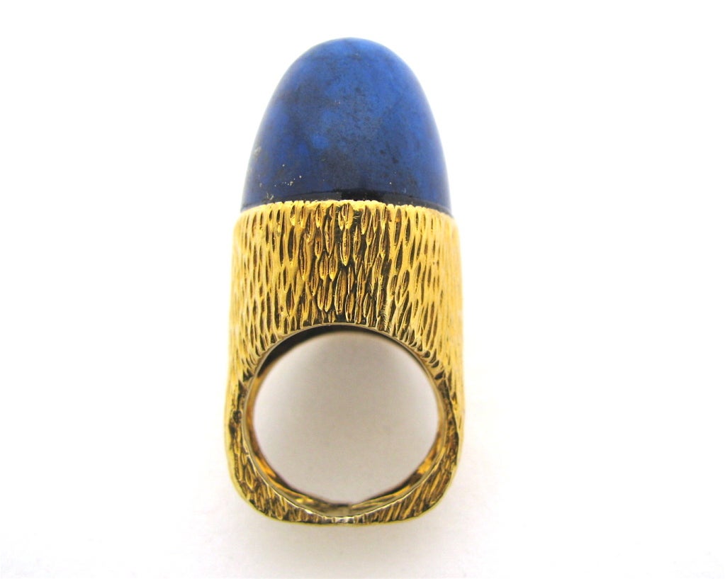 1970's  lapis lazuli ring by New York jeweler, R.Stone. The textured 18k yellow gold ring with an exaggerated 1