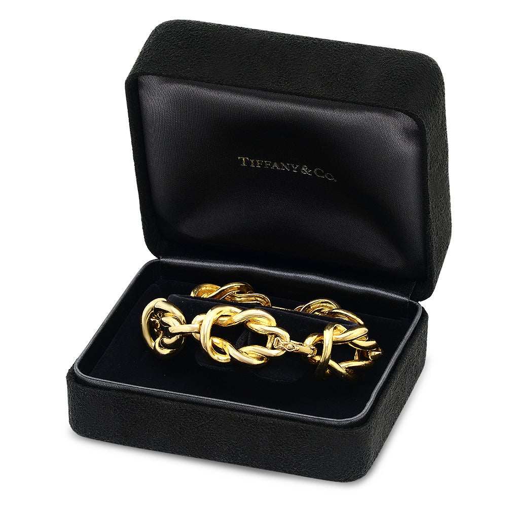 Knot motif Tiffany & Co. 18k Yellow Gold Link Bracelet. 7.5 inches Length and 1/2 Inch Width. Signed Tiffany & CO 18k