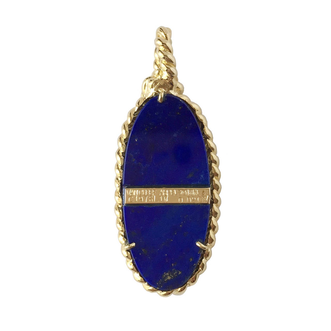 Van Cleef & Arpels 18K gold pendant representing an anchor on a lapis lazuli plaque, circa 1970s. The gold anchor is accented with a 0.02ct diamond.
 A nautical style loved around the world, the anchor represents hope and maritime