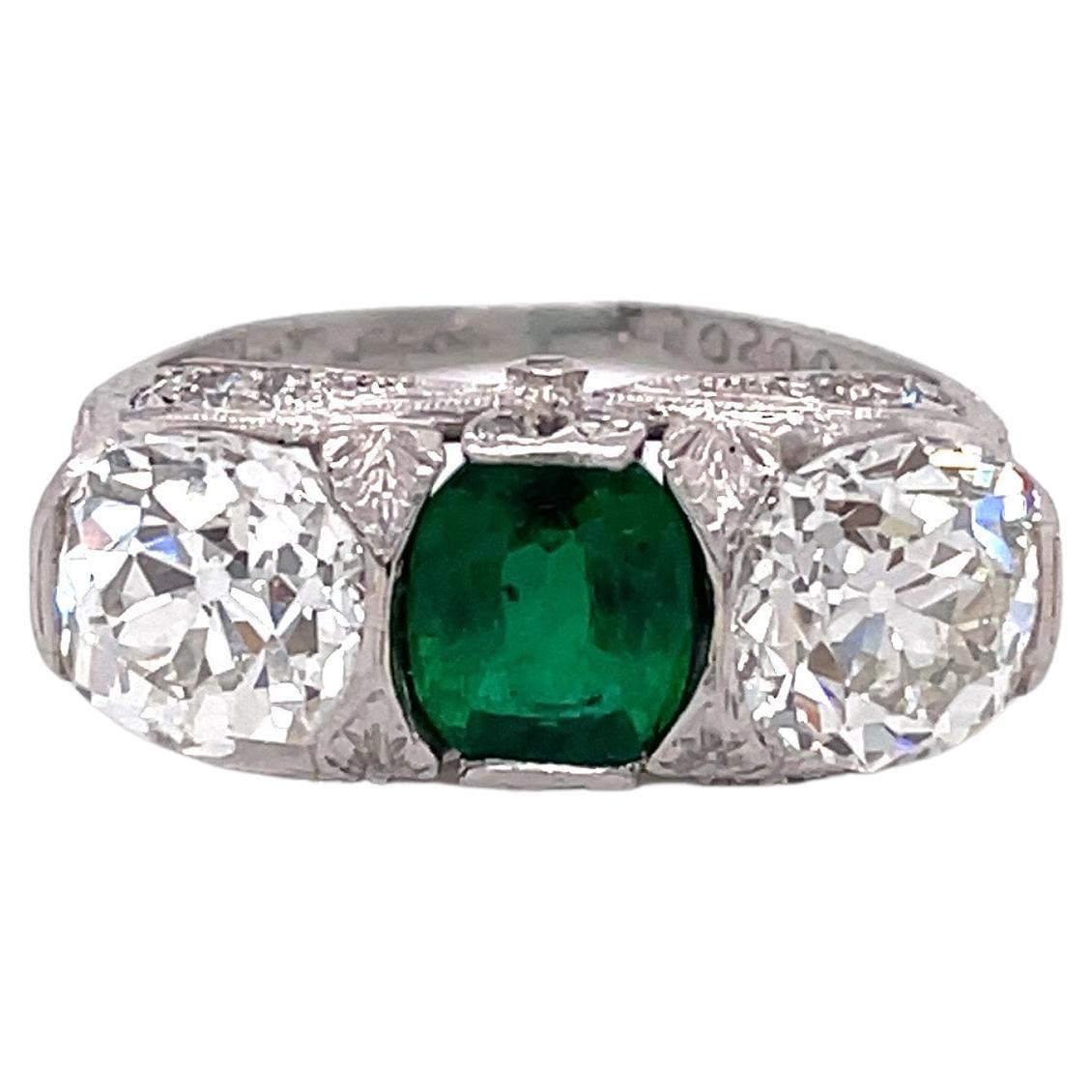 Antique Art Deco J.E. Caldwell Emerald and Diamond Three Stone Platinum Ring For Sale