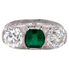 Antique Art Deco J.E. Caldwell Emerald and Diamond Three Stone Platinum Ring