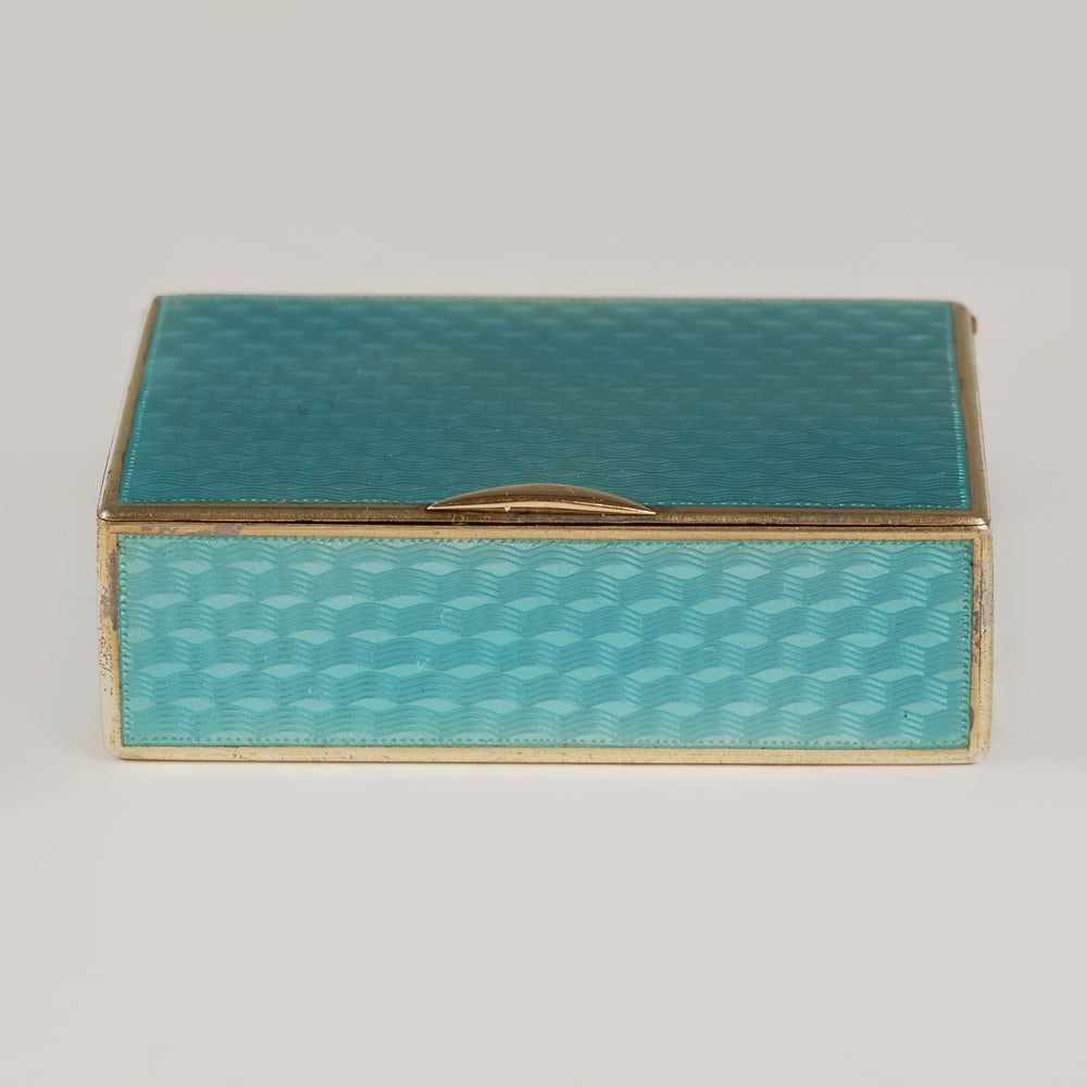 A Fabergé gilded silver and guilloché enamel match box (vesta case), Moscow, 1899-1908, Fabergé scratched inventory number 28271. Of rectangular form, the exterior enameled entirely with translucent teal blue enamel over a wavy engine-turned ground,