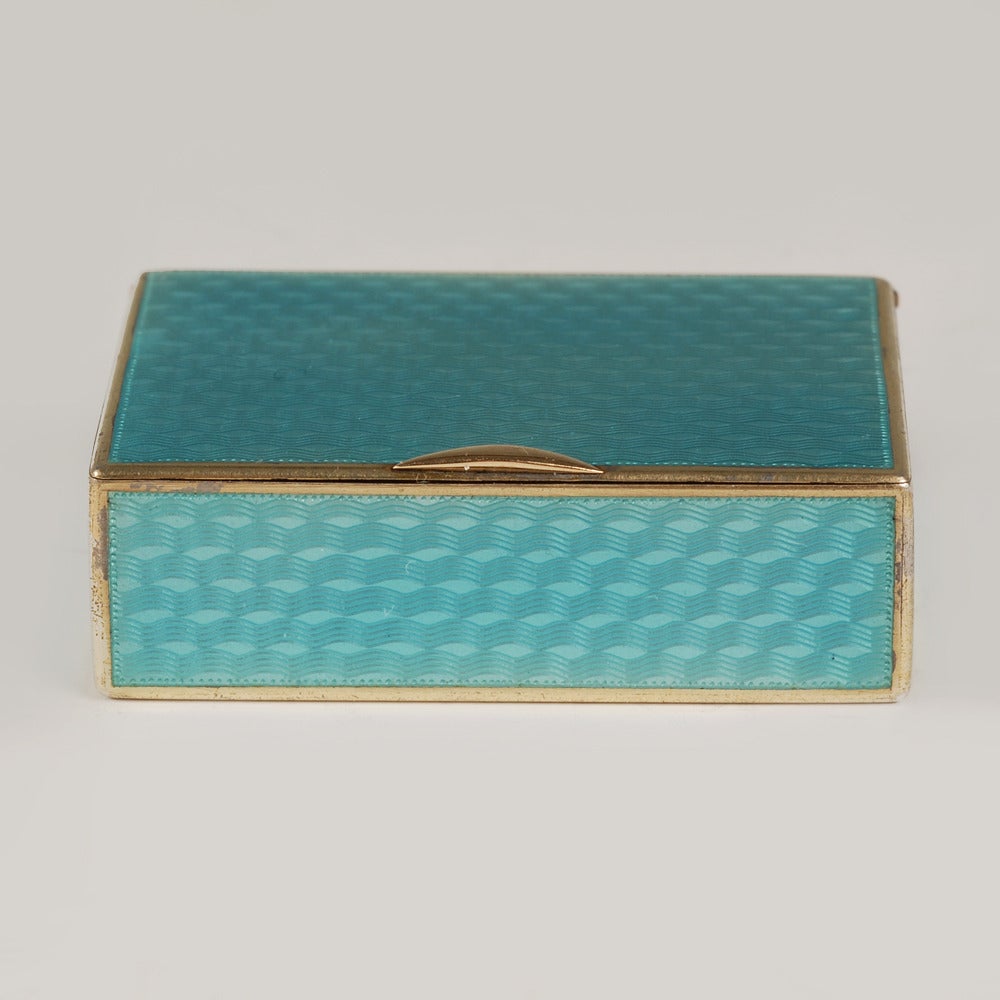 A Fabergé gilded silver and guilloché enamel match box (vesta case), Moscow, 1899-1908, Fabergé scratched inventory number 28271. Of rectangular form, the exterior enameled entirely with translucent teal blue enamel over a wavy engine-turned ground,