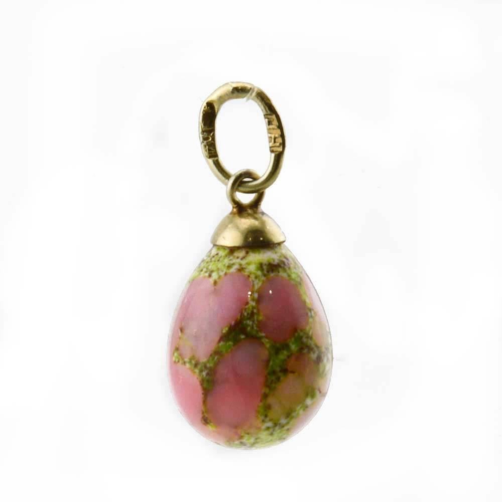 An antique Russian silver gilt-mounted semiprecious unakite miniature pendant Easter egg, Moscow, 1908-1917. The egg carved from a pale pink and celadon green unakite, set with silver gilt cap-form mount, the suspension struck with 84 silver