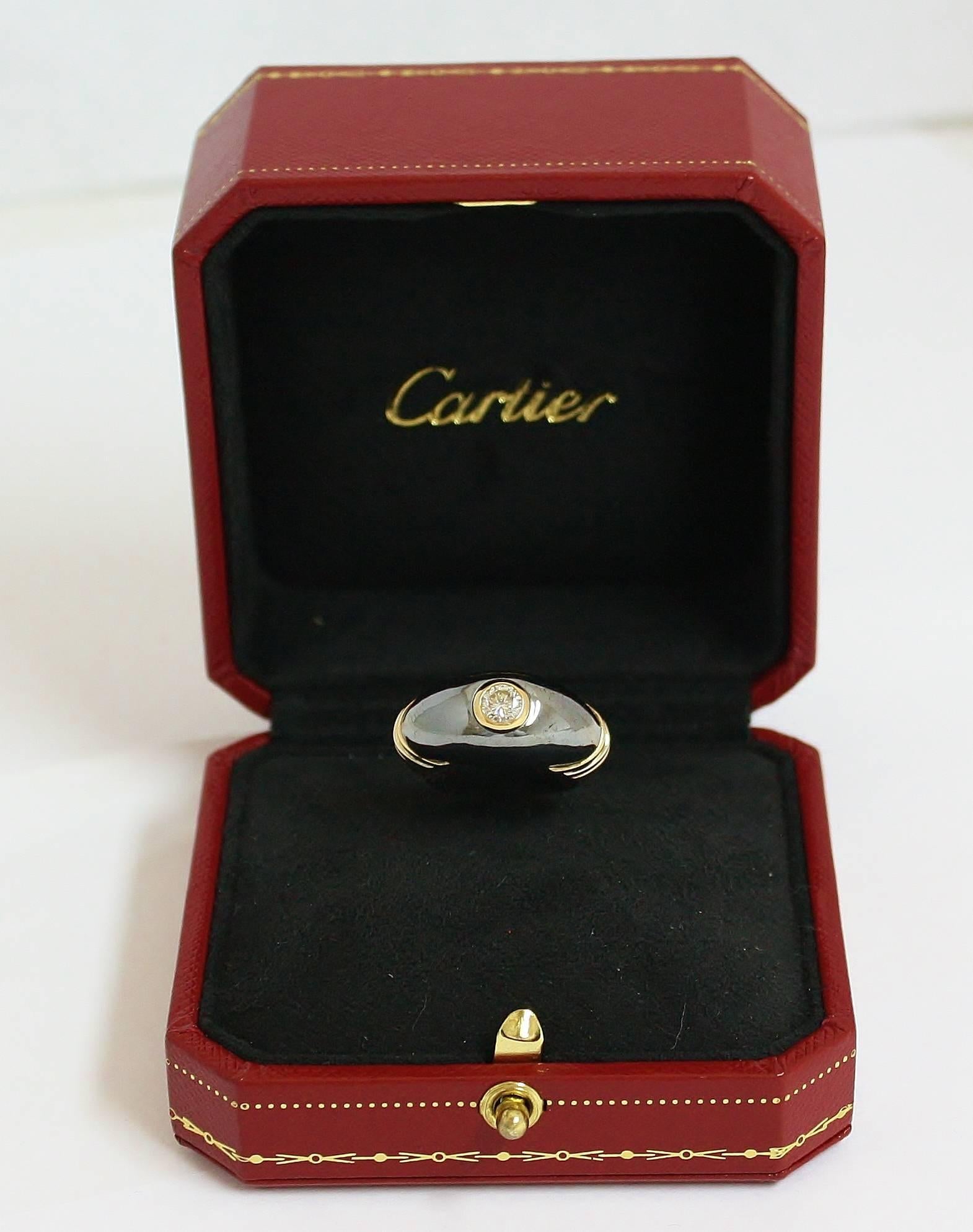This vintage Cartier dome ring combines so much in one ring. The ring is cast in  18kt yellow gold with tricolor bands on each side of the silverium dome center. Silverium is a custom silver alloy trademarked by Cartier that gives the metal a