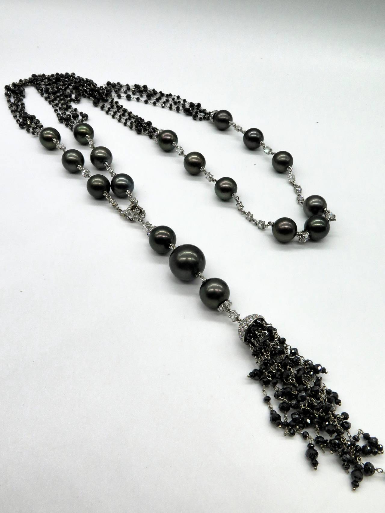 Absolutely magnificent natural black diamonds and white diamond tassel necklace with black Tahitian pearls. The black diamonds beads weighs approx. 19.55cts and the white diamonds weighs approx. 10.20cts. The white diamonds are G-H color and VS