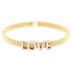 Bracelet semi-rigé en or jaune 18 carats avec inscription " LOVE Writing in Diamonds Ct.0.30
