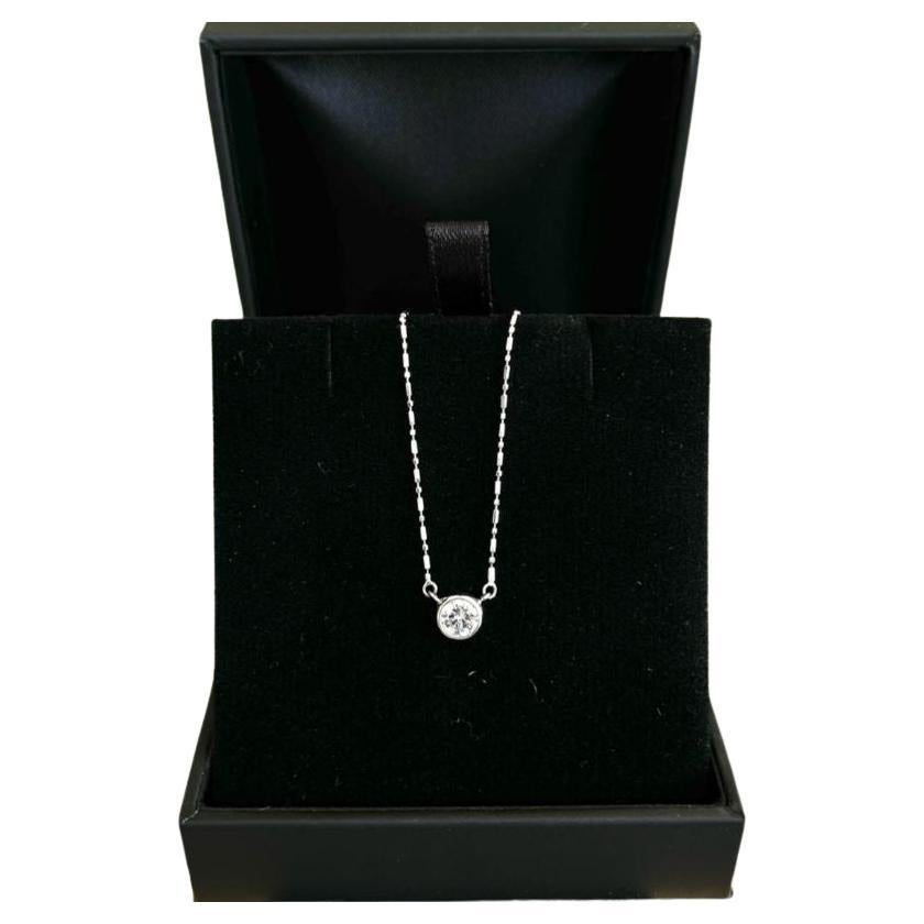 Diamond Pendant and necklace, crafted with eighteen karat white gold, featuring an elegant round brilliant cut diamond , complemented by a unique fancy link chain and a beautiful polished finish design. 

Diamond Weight: 0.50ct 
Diamond