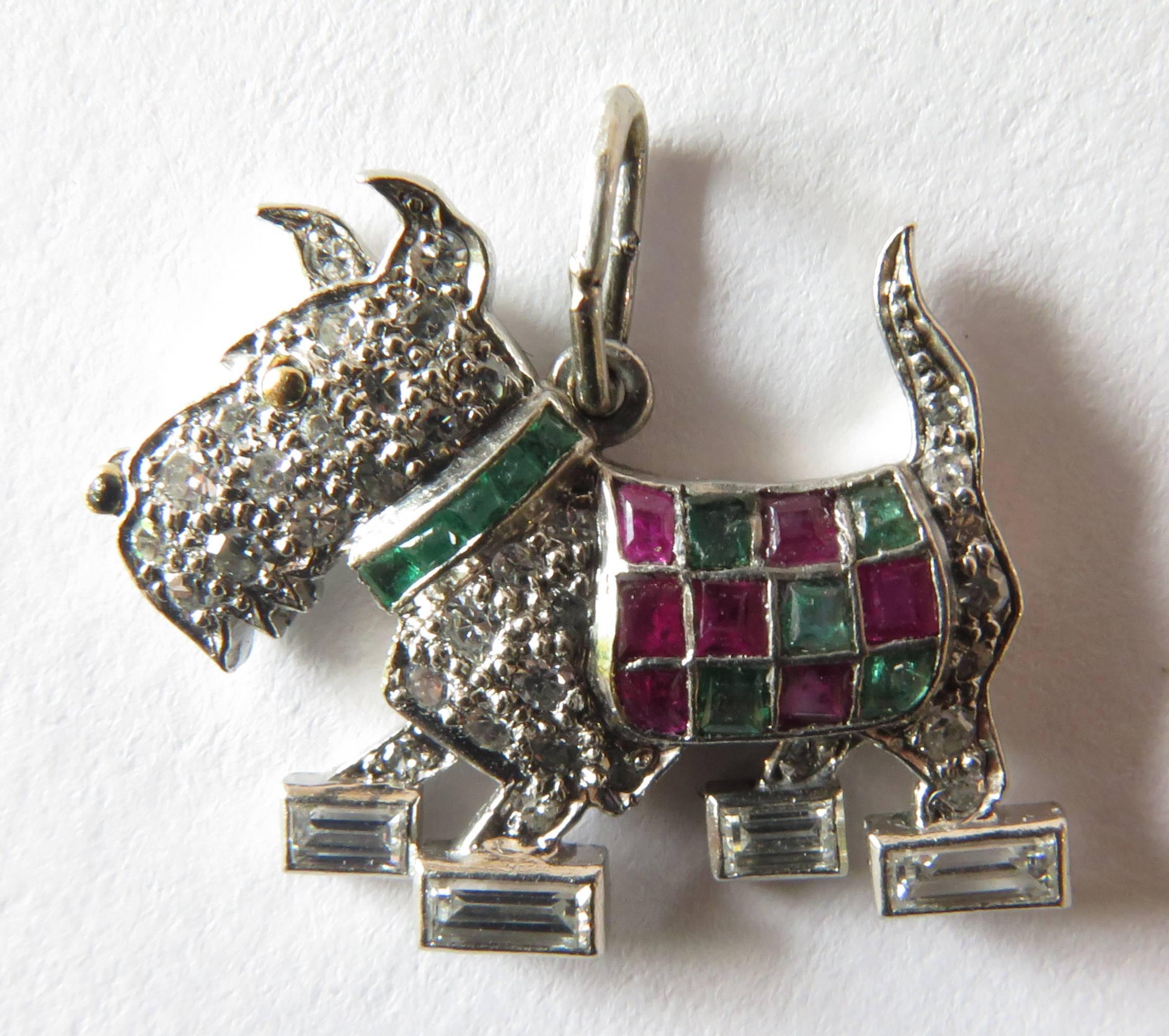 This adorable Scottish Terrier is exceptional in so many ways. His scottish checkerboard coat is made of emeralds and rubies. His collar is all channel set emeralds. His nose is black enamel. His eye is high carat yellow gold drop. And the rest of