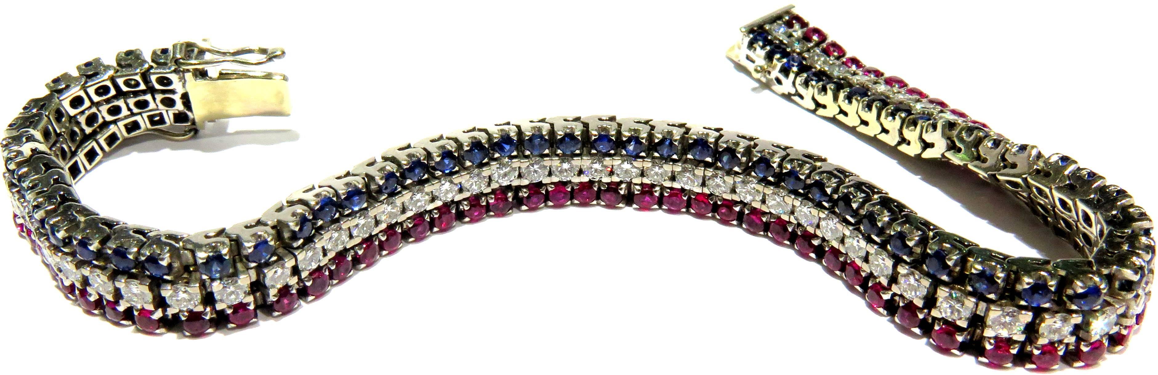 This elegant bracelet drapes around the wrist like silk. It is extrememly comfortable to wear and goes with almost anything. There are approximately 5 carats of diamonds and approximately 9.60 carats of rubies and sapphires.
This bracelet measures