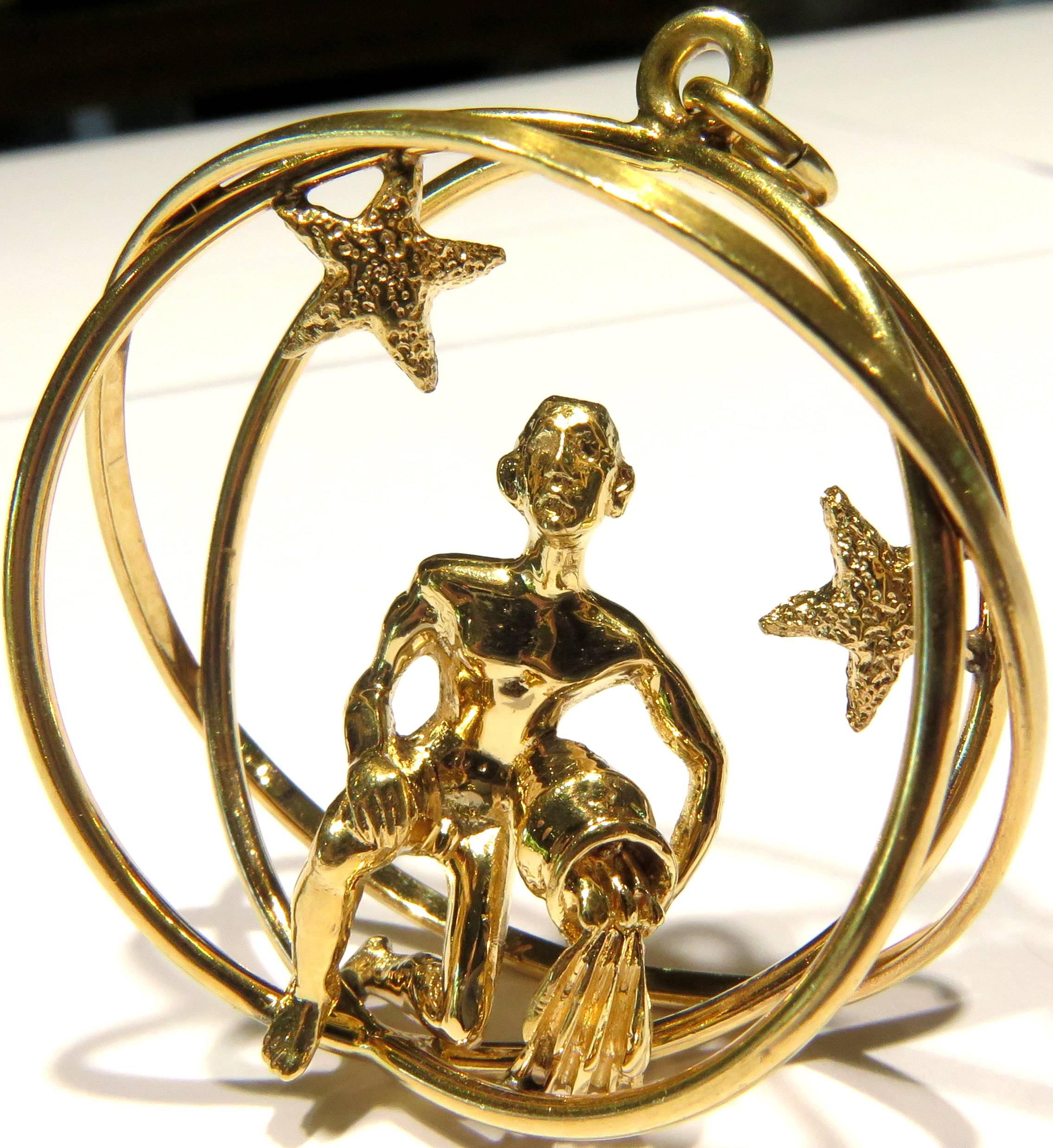 This amazing 3 D anatomically correct man pouring water from an urn is surrounded by 3 sphere's and two star's is technically an Aquarius sign, but you certainly don't need to be an Aquarius to wear it!  I bought it over 50 years ago just because I