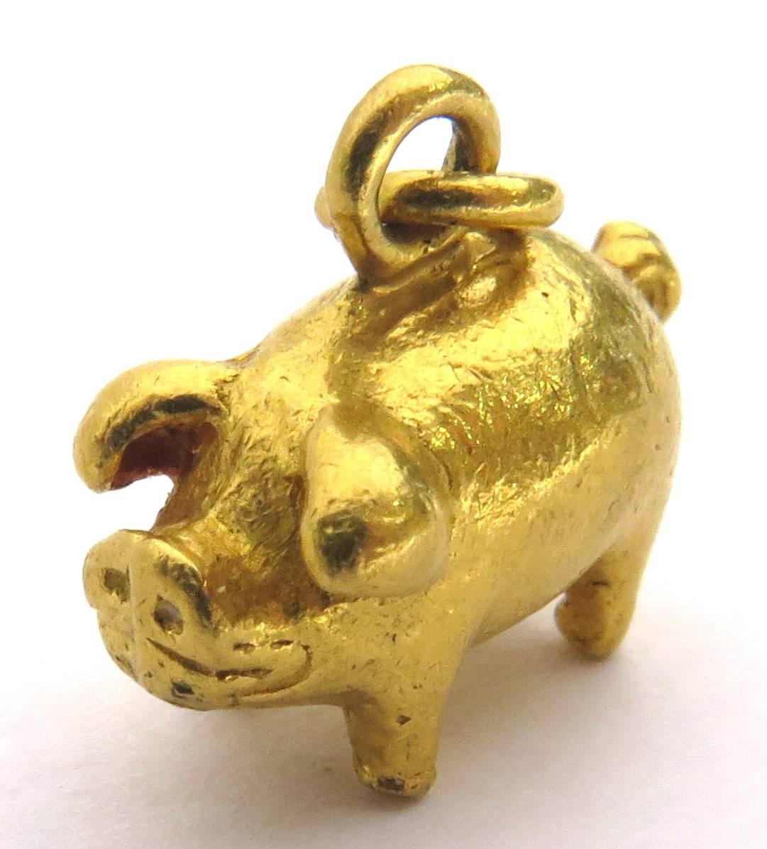 Any angle you use to look at this little guy is his good side. And his little snout is just irresistible! He is made of 22k gold and has a beautiful patina. He can be worn as either a charm or a pendant.
This little piggy weighs 3.1 grams
This