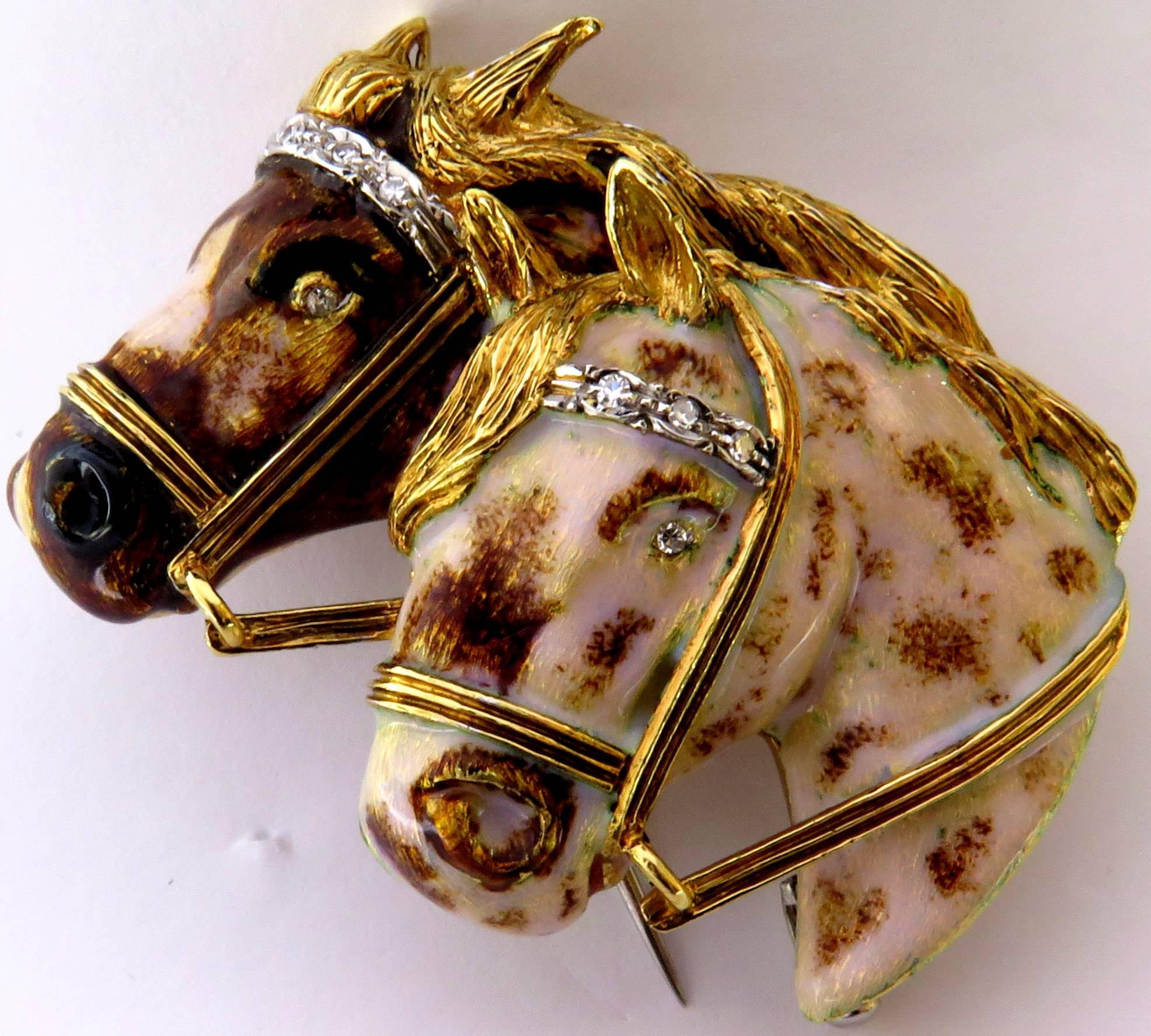 This 18k gold dynamic horse pin duo has incredible personality. The enamel on these two spotted horses just adds so much dimension. Each horse has a diamond eye and diamond accents on their bridles. 
This pin weighs 24.1 grams
This pin measures 2